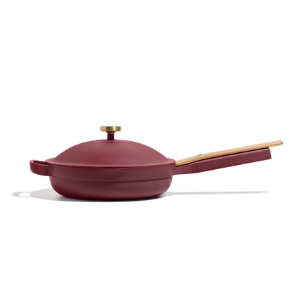 The Always Pan 2.0, a red pan with a lid from our bestselling cookware collection, is perfect for versatile cooking.