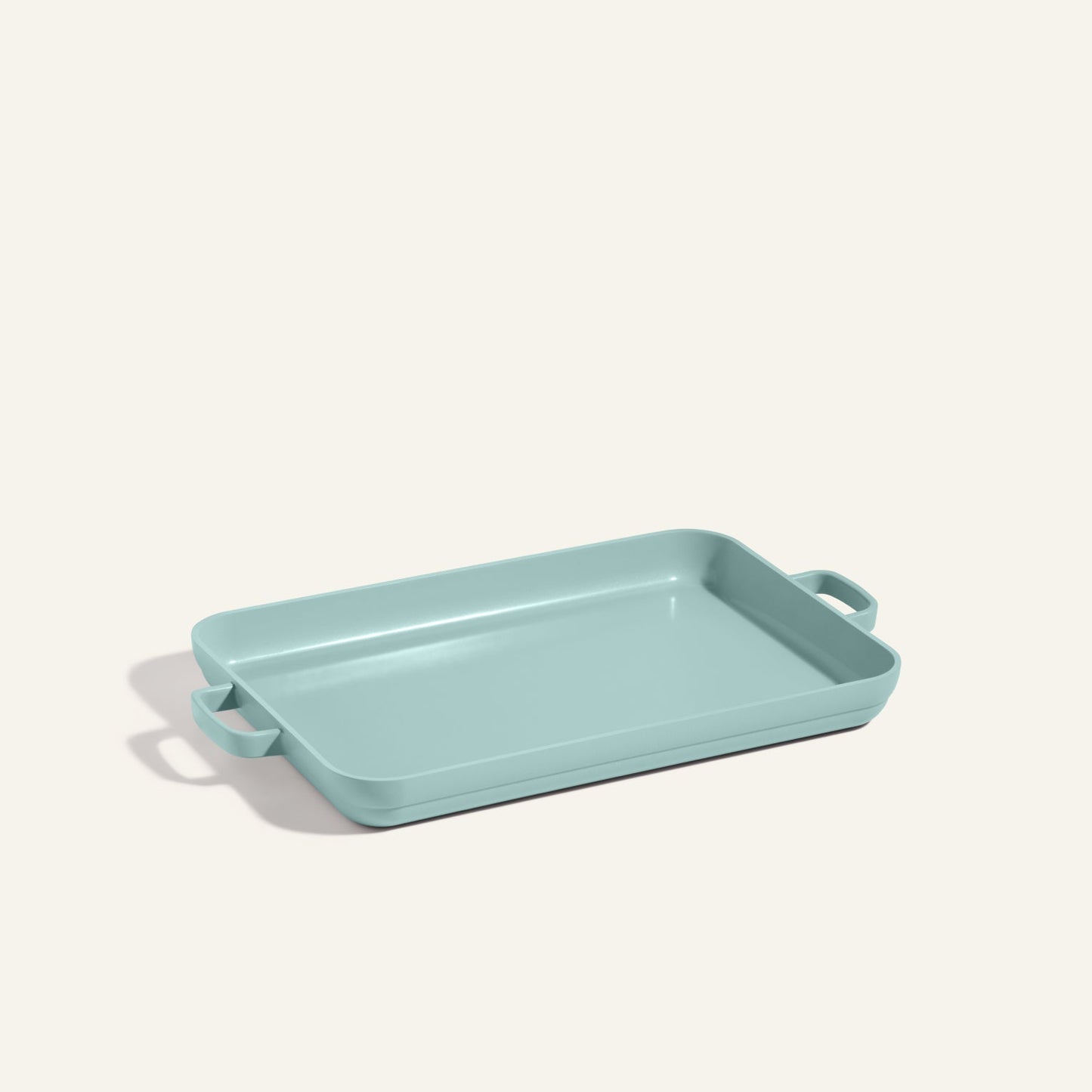 Light blue rectangular Griddle Pan with nonstick surface and handles on both sides, displayed on a plain off-white background.