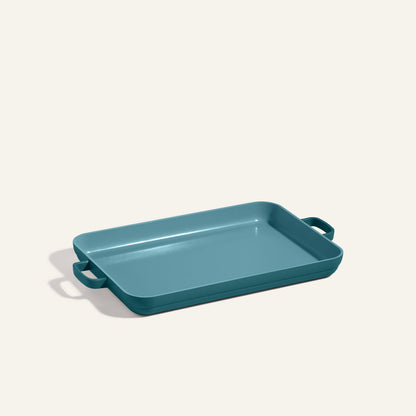 Teal rectangular Griddle Pan with two handles, shown on a plain light background—ideal to pair with your favorite nonstick sheet pan for versatile cooking and easy cleanup.