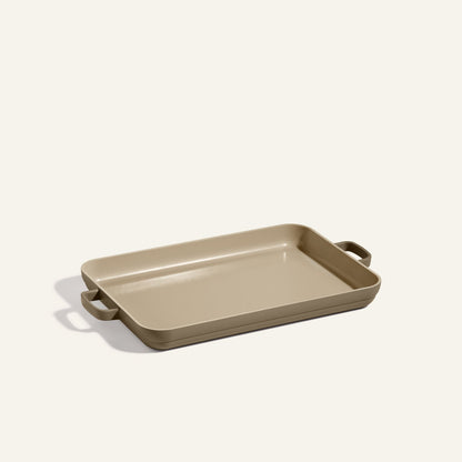 Rectangular beige baking dish with two handles, placed on a light background—perfect for pairing with your Griddle Pan or nonstick sheet pan for versatile kitchen use.