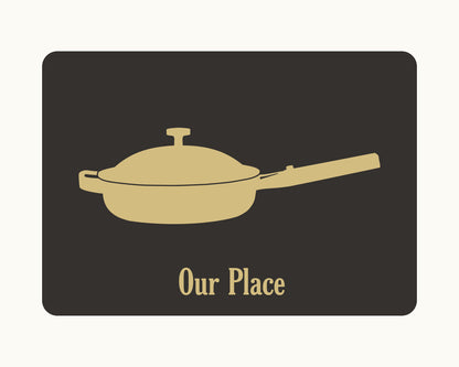 A gold silhouette of a lidded frying pan with a long handle appears above "Our Place" on a dark rectangle—perfect as an Our Place Gift Card for a thoughtful housewarming gift.