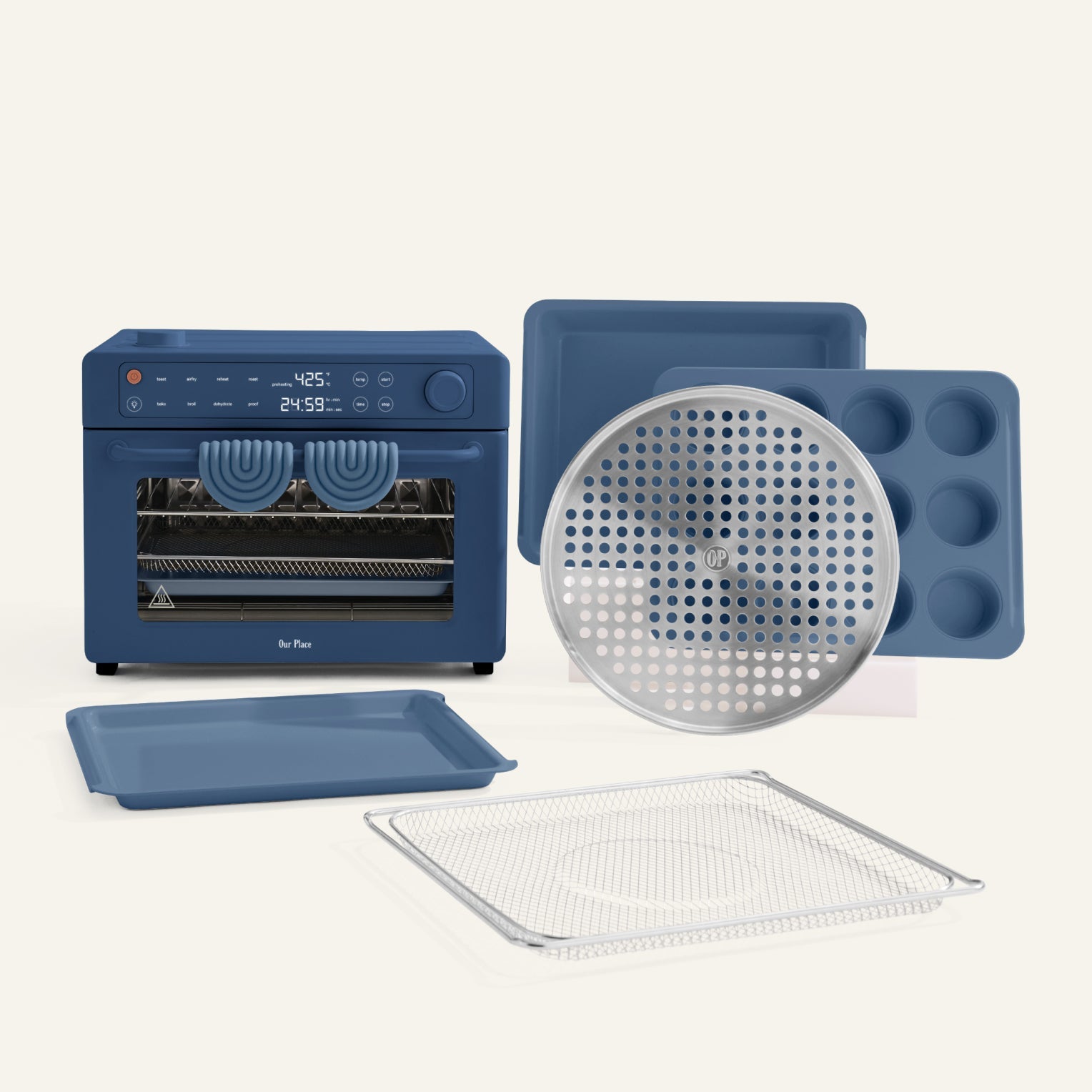 Blue toaster oven with various accessories on a white background