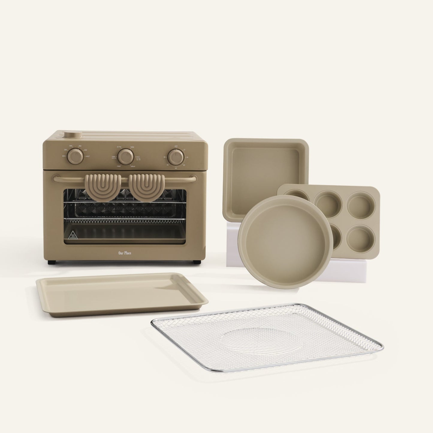 Set of beige kitchen appliances and cookware on a white background
