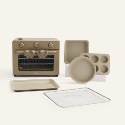 Set of beige kitchen appliances and cookware on a white background