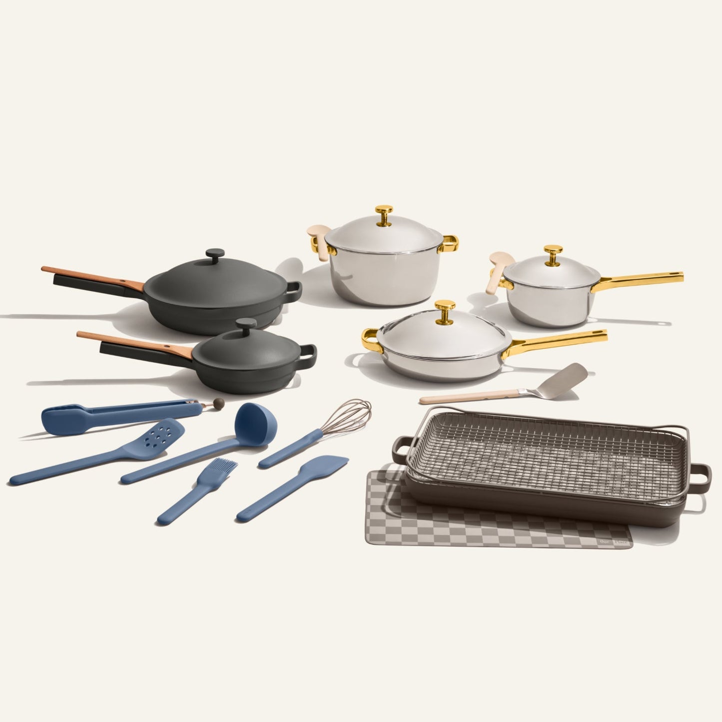 The Home Chef Set (25 piece) includes non-toxic cookware, pots, pans, a roasting pan, lids, and assorted blue and gray kitchen utensils—all displayed on a light background.