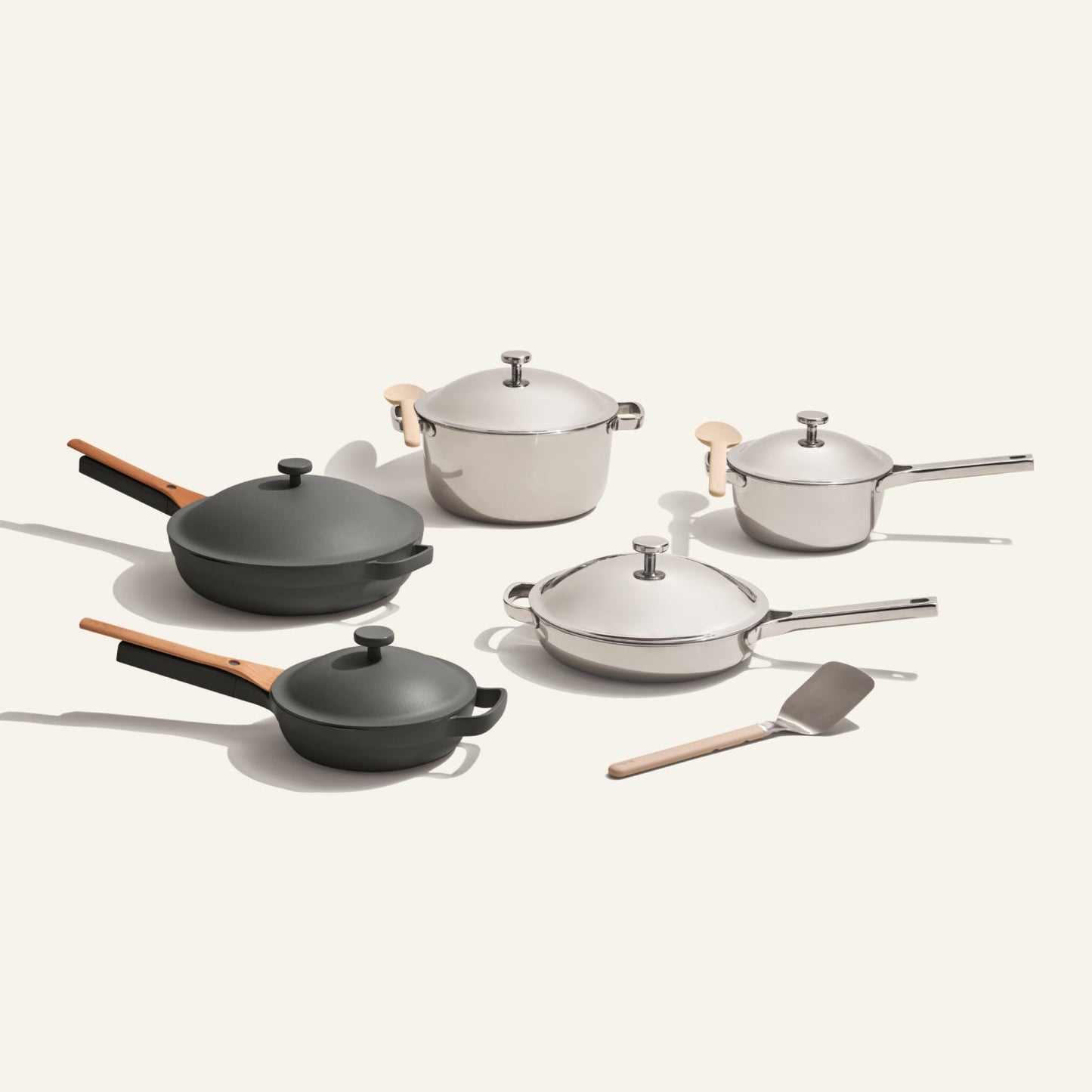 The Home Chef Set (15 piece) features two saucepans, a sauté pan, a stock pot, a frying pan, a small pot with lids, and a spatula, all arranged on a plain background.