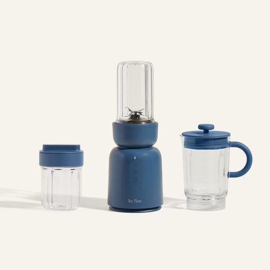 The Splendor Blender + Splendor Blender Everything Kit features a blue blender with a clear jar, plus an extra jar with lid and a lidded pitcher, shown on a neutral background.