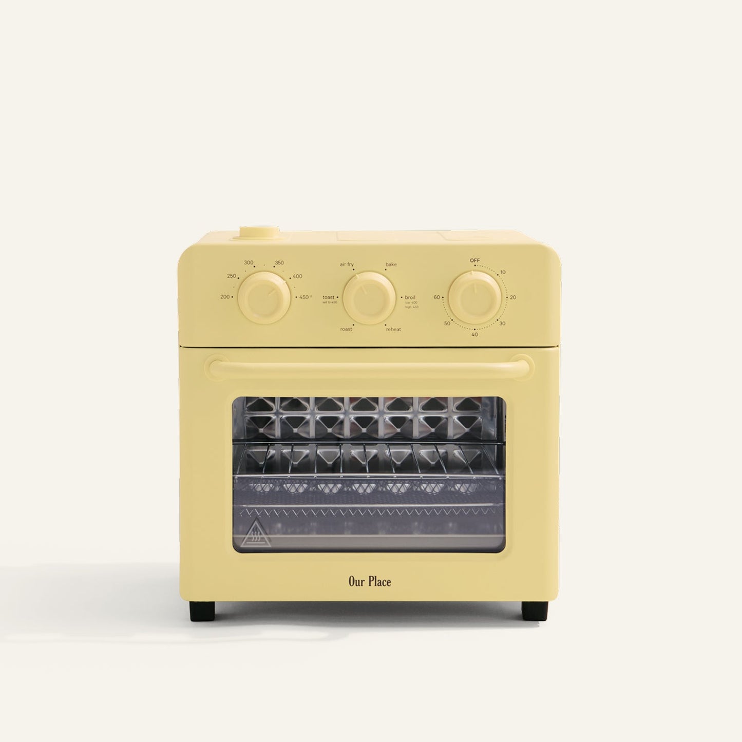 Yellow toaster oven with clear glass door on a white background
