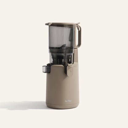 Beige juicer on a white background